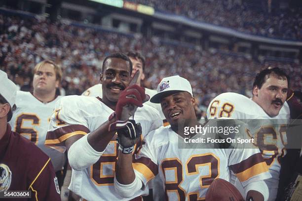 Ricky Sanders and Art Monk of the Washington Redskins gesture "#1" after defeating the Buffalo Bills for Super Bowl XXVI at the Metrodome on January...