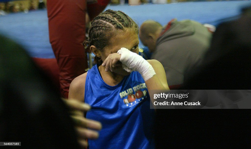 The Region VIII Junior Olympics in Norwalk. Seneisa Estrada wipes away tears after losing to Daveen