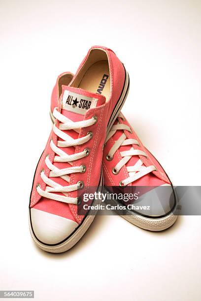 The tennis shoe of Marie Antoinette worn in the movie by actress Kirsten Dunst is the pink Converse.