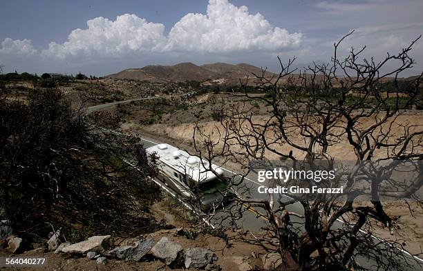 The landscape still shows its scorched scars from a wildfire last year along Highway 243, near the town of Idyllwild. It is only one of 2 ways to...