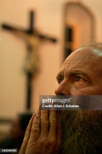 Raymond Byrnes a homeless man who lives on Skid Row, prays while attending La Placita Church near Olvera Street, which he does twice daily, once at...