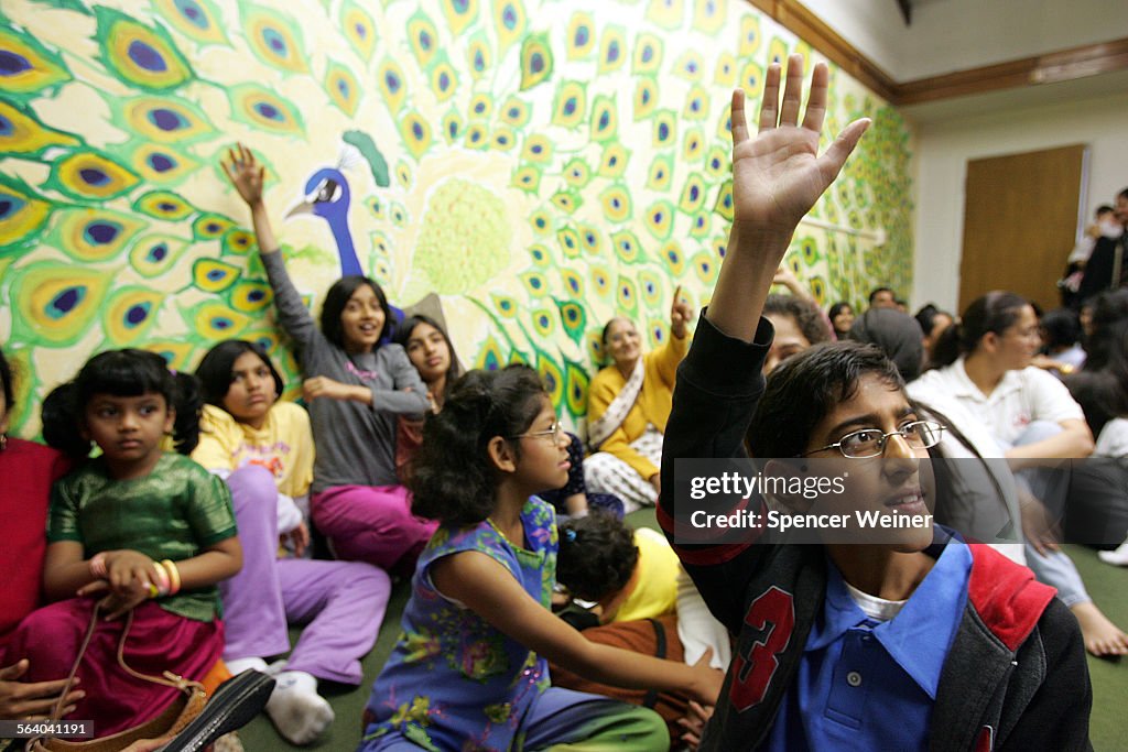 Sachin Verma,10, right, answers questions during Hindu Sunday school at Sanatan Temple on Pioneer B