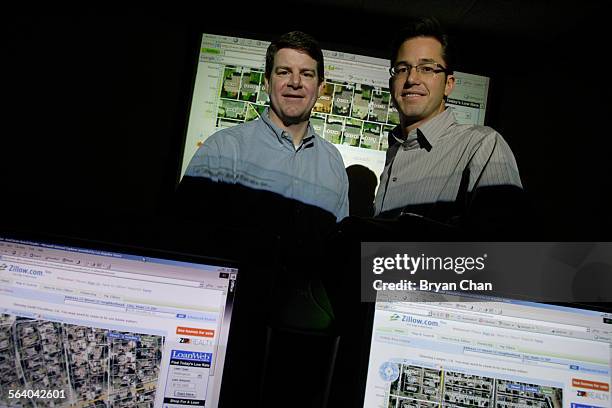 Zillow president Lloyd Frank, left, and chairman and CEO Richard Barton with projections of their website zillow.com. The real estate website offers...