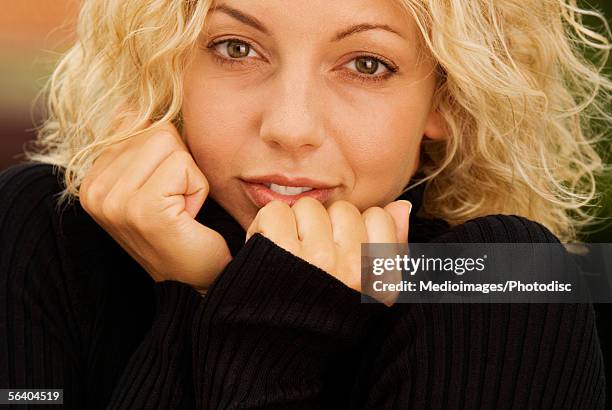 close-up of a young woman shivering - sweater shivering stock pictures, royalty-free photos & images