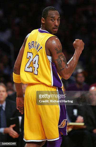 Laker Kobe Bryant pumps his fist as he looks back at the ref making the call after making a basket and getting the foul vs. Clippers during first...