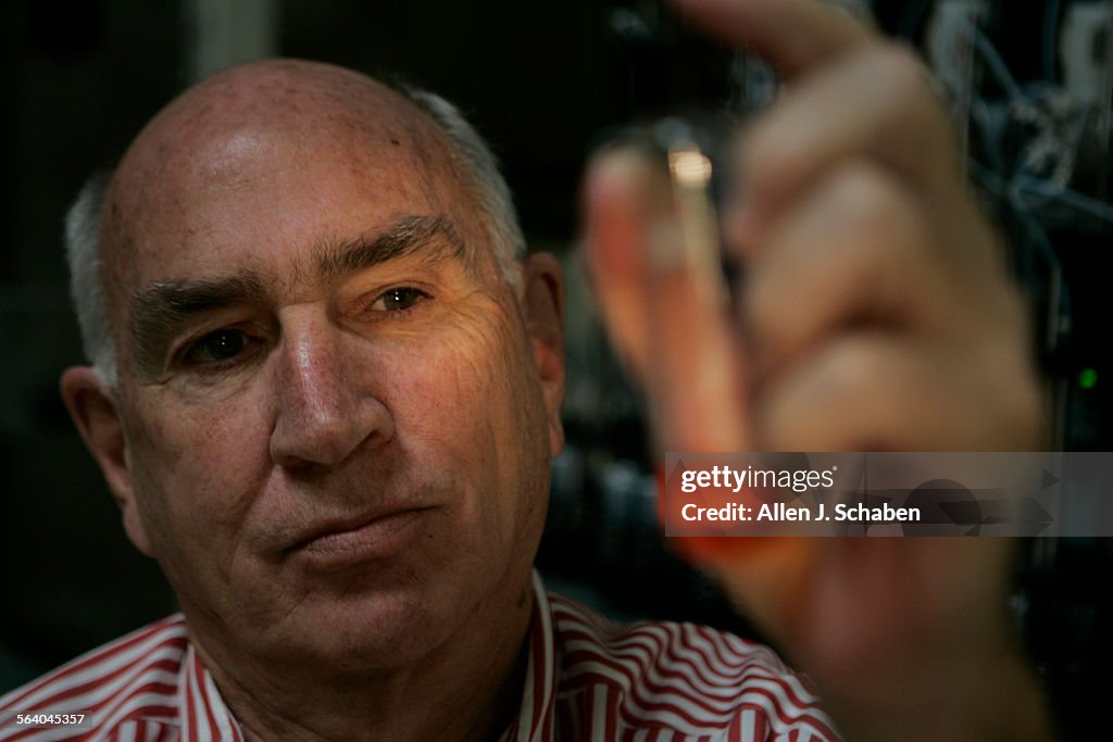 Don H. Catlin, director of UCLA Olympic Lab, holds a urine sample, which will be tested for banned
