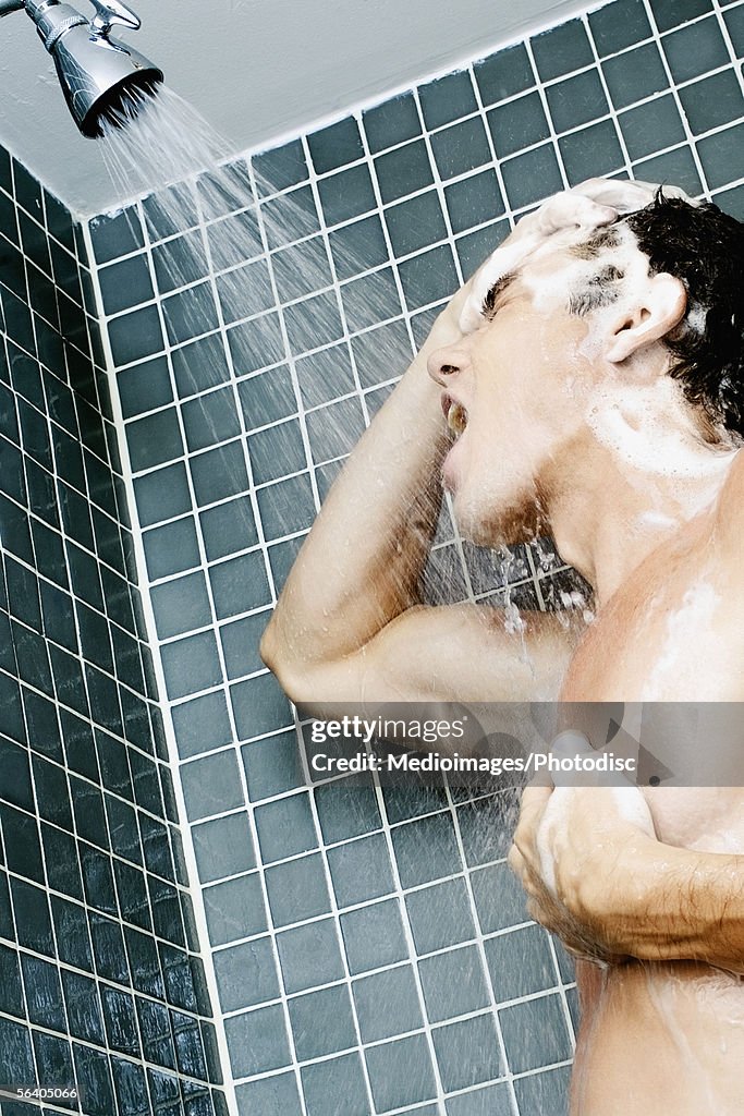 Low angle view of a young man bathing