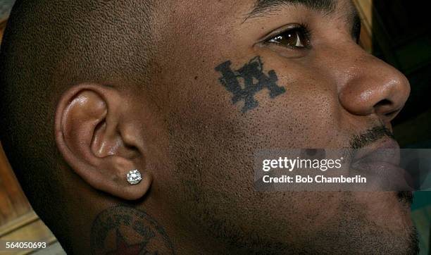 Gangsta rapper from Compton, "the Game", whose last album sold 5 million copies at his home in Glendale on .