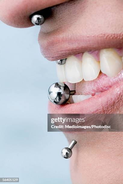 close-up of piercing on a woman's face - piercing stock pictures, royalty-free photos & images