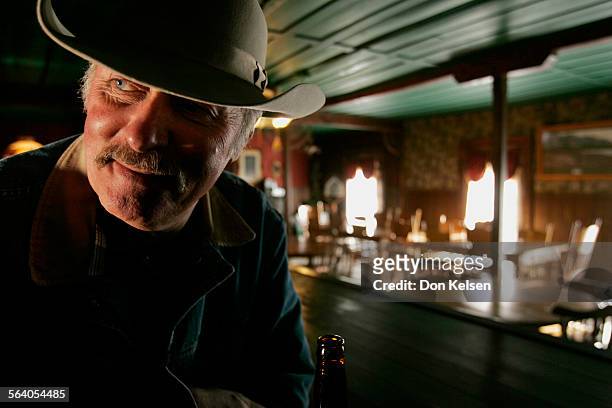   The former riproaring 1870s silver town  Cerro Gordo  is fighting to stay alive. Owner/caretaker Mike Patterson, seen here at the bar in the...
