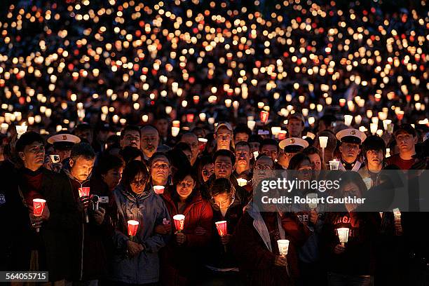 Thousands of Virginia Tech students, staff, family and supporters fill the University's parade grounds for somber, yet emotional candlelight vigil...