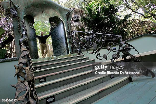 Karl Johnson, standing at the top of the stairs, created this metal portal, the entrance to a creek side retreat at the Beers' home. Thom Beers, the...