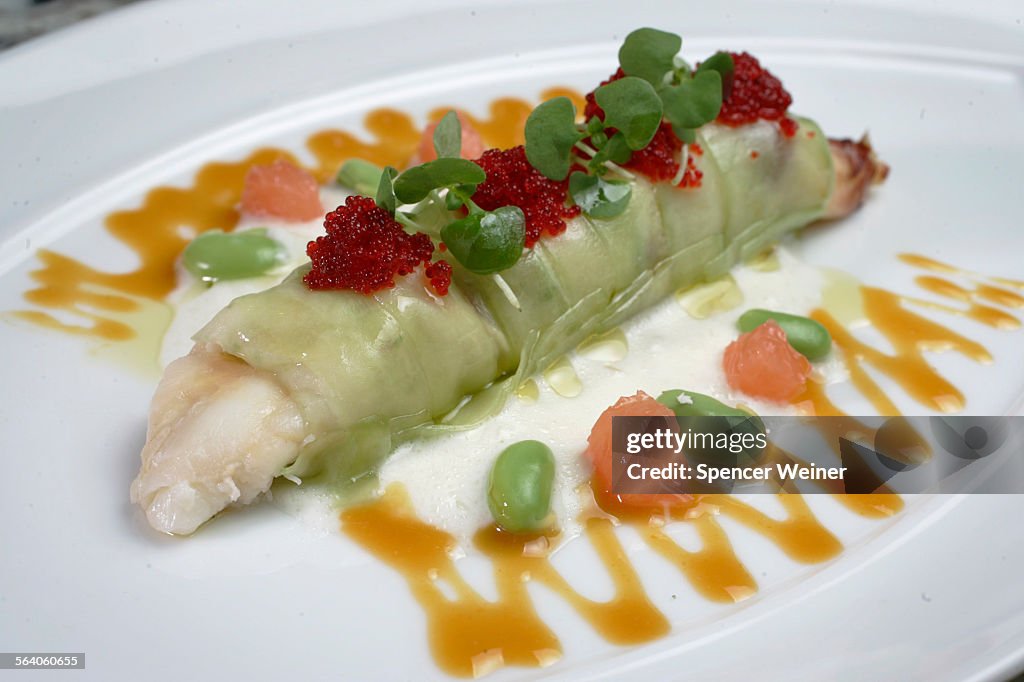 Dungeness Crab with cucumber cannelloni and Citris–Grapefruit essence, garnished with spicey pepper