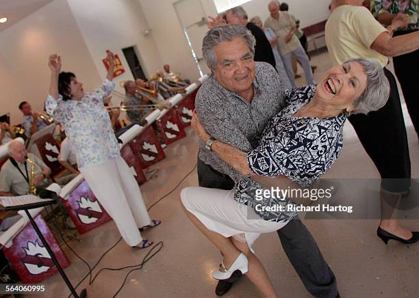 Yearsyoung, Sparky Ingle of Rolling Hills Estates is all smiles as she gets dipped by Juan Monroy of L.A. As the two keep cool while they dance to...