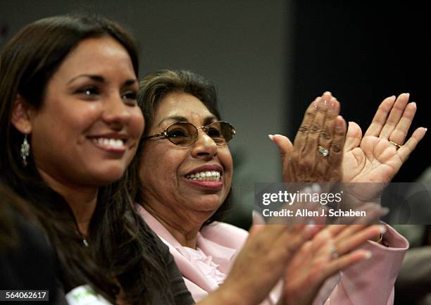 Sylvia Mendez, right, and her neice Mistala Mendez Mooney, cheer during a panel discussion with Minnijean Brown and Dr. Terrence Roberts, members of...