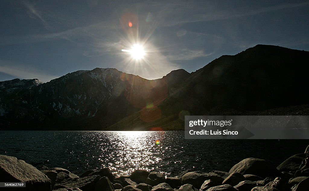 The sun glistens on the surface of Convict Lake in the Eastern Sierra Mlountains near Mammoth.