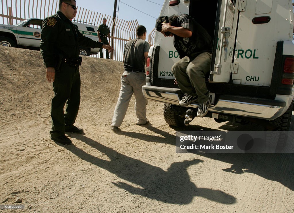 (Chula Vista, CA)US Border Patrol Agents round up a group of suspected illegal aliens found in the