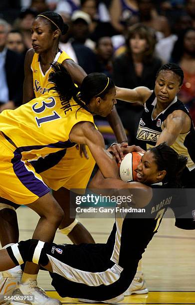 Jessica Moore of Los Angeles Sparks battles for the ball with Chantelle Anderson of the San Antonio Silver Star during game action at Staples Center...