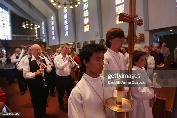 Encino. The Dixieland band follows the altar boys during the procession as the beginning of the Dixieland Mass. They are playing "Oh When the Saints...