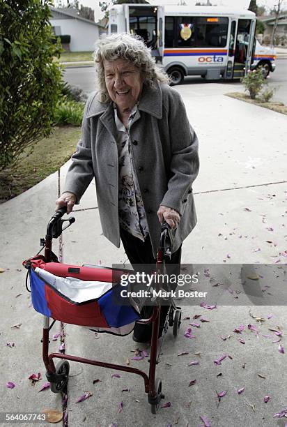 Dorothy Miller arrives at her Anaheim home after a ride on the OCTA Access van. Veolia Transportation, the company that contracts with the Orange...