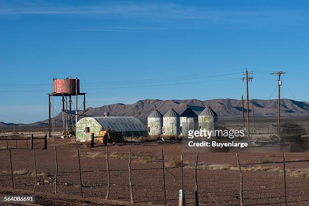 Weathered metal structures in the mostly deserted town of Lobo, south of Van Horn on U.S. 90 in Culberson County, Texas