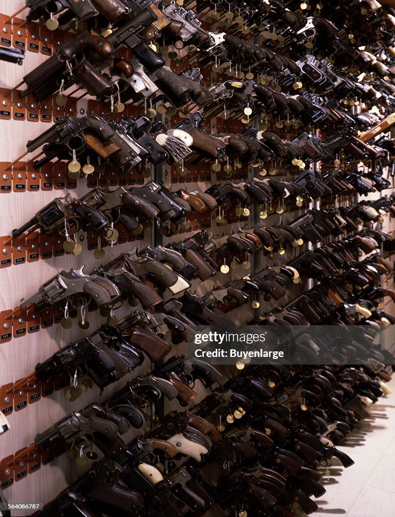 Confiscated guns on a display at the F.B.I. Headquarters, Washington, D.C.