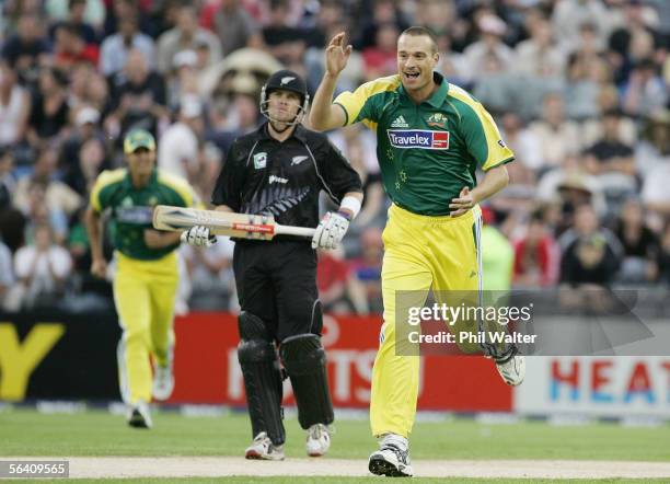 Stuart Clark of Australia celebrates his dismissal of Nathan Astle of New Zealand as Lou Vincent looks on during the third Chappell-Hadlee Trophy one...