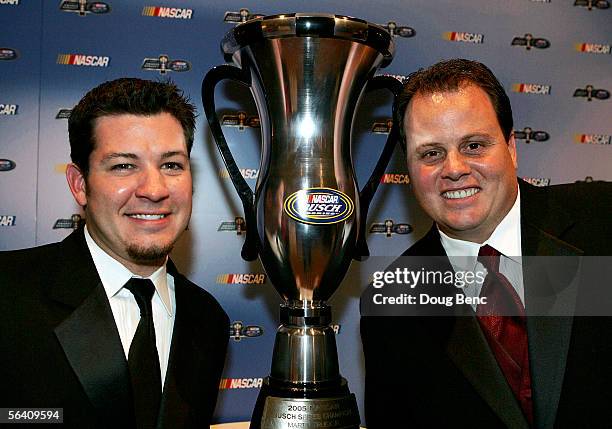 Busch Series champion Martin Truex Jr. Poses with crew chief Kevin Manion and the championship trophy during the NASCAR Busch Series Banquet at the...