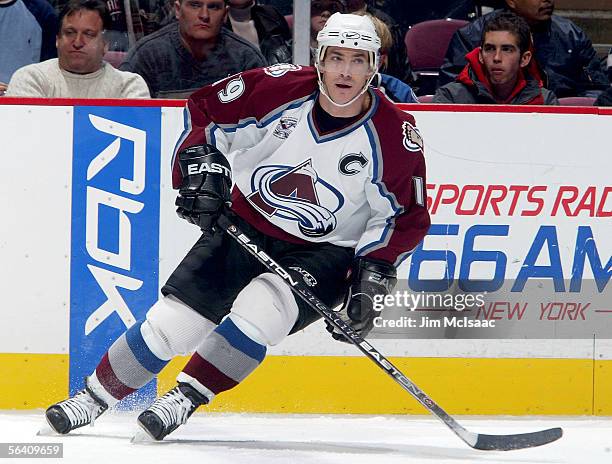 Joe Sakic of the Colorado Avalanche skates against the New Jersey Devils during their game on December 9, 2005 at Continental Airlines Arena in East...