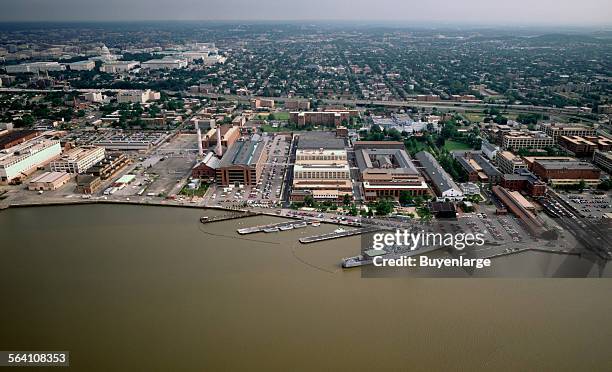 Aerial view with a focus on plants and other buildings along the Potomac River, Washington, D.C.