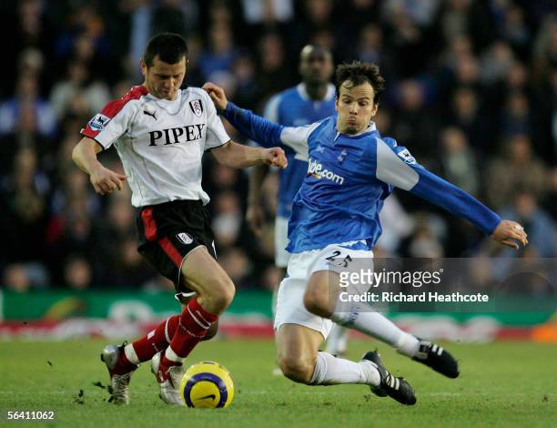 Stephen Clemence of Brimingham tackles Thomaz Radzinski of Fulham during the Barclays Premiership match between Birmingham City and Fulham at St....