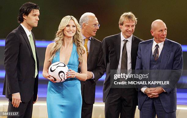 German top model Heidi Klum holds the new World Cup 2006 offical ball christened "Teamgeist" as German national team captain Michael Ballack, German...