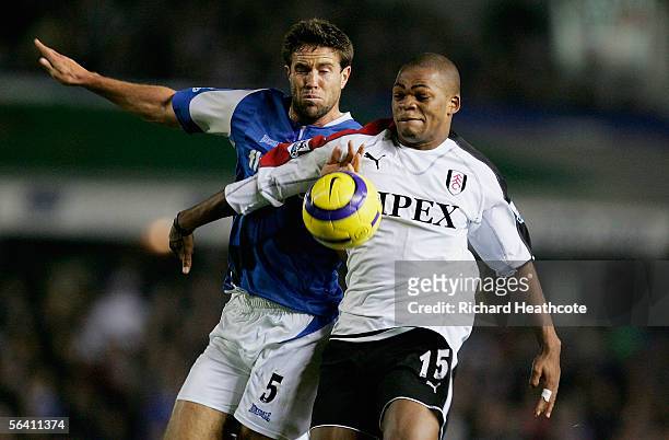 Collins John of Fulham holds off Matthew Upson of Birmingham during the Barclays Premiership match between Birmingham City and Fulham at St. Andrews...