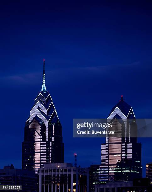 Twin towers of Liberty Place, photographed here at dusk, rose in 1987 and 1990 respectively in Philadelphia, Pennsylvania