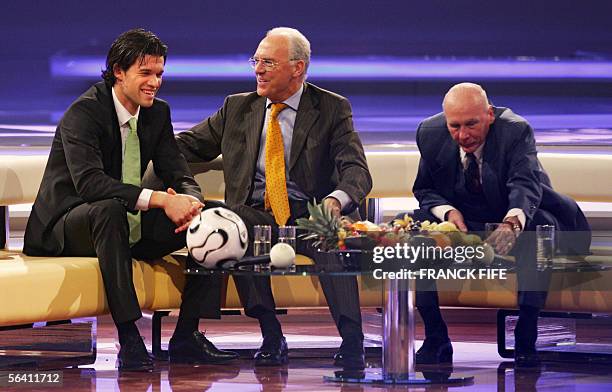 German national team captain Michael Ballack, German football legend Franz Beckenbauer and German 1954 football World Champion Horst Eckel sit on...