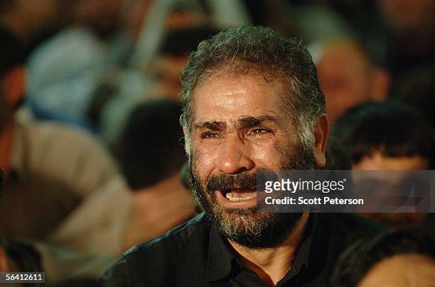 Shiite devotee cries during prayers at the Jamkaran Mosque December 6, 2005 in Jamkaran, Iran. Some Iranian Shiites believe and are waiting for the...
