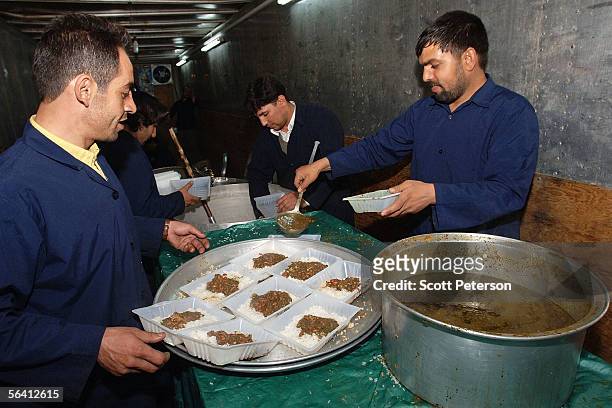 Cooks prepare hundreds of meals for pilgrims at the Jamkaran Mosque December 6, 2005 in Jamkaran, Iran. Some Iranian Shiites believe and are waiting...