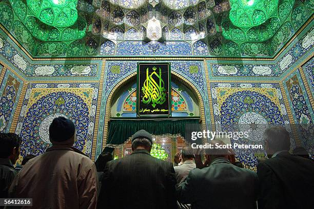 Iranian Shiites spill oustside of the Jamkaran Mosque to pray December 6, 2005 in Jamkaran, Iran. Some Iranian Shiites believe and are waiting for...