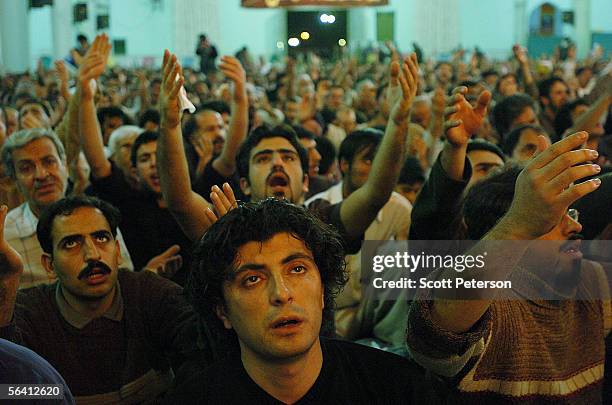 Iranian Shiites pray at the Jamkaran Mosque December 6, 2005 in Jamkaran, Iran. Some Iranian Shiites believe and are waiting for the return of the...