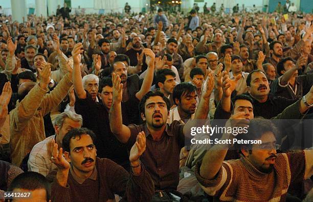 Iranian Shiites pray at the Jamkaran Mosque December 6, 2005 in Jamkaran, Iran. Some Iranian Shiites believe and are waiting for the return of the...