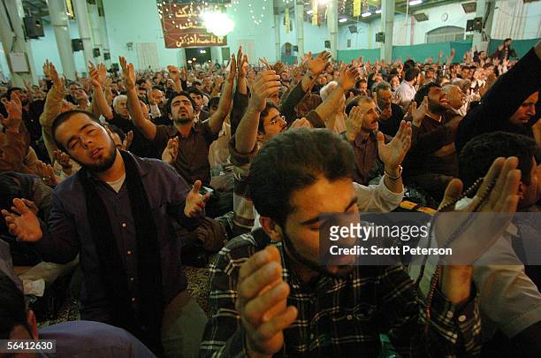 Iranian Shiites pray at the Jamkaran Mosque December 6, 2005 in Jamkaran, Iran. Some Iranian Shiites believe and are waiting for the return of the...