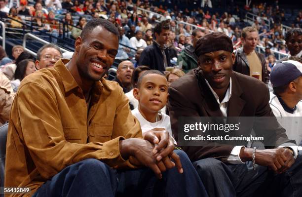 David Robinson, Corey Robinson and Kevin Willis enjoy the Atlanta Hawks game against the San Antonio Spurs on December 10, 2005 at Philips Arena in...
