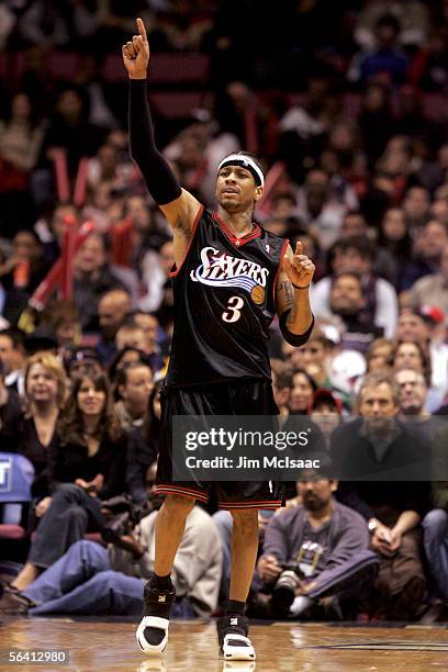 Allen Iverson of the Philadelphia 76ers reacts to a basket scored against the New Jersey Nets during their game at Continental Airlines Arena on...