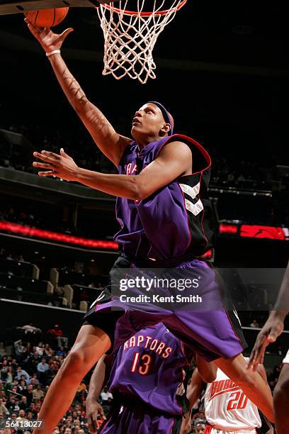 Charlie Villanueva of the Toronto Raptors shoots against the Charlotte Bobcats on December 10, 2005 at the Charlotte Bobcats Arena in Charlotte,...