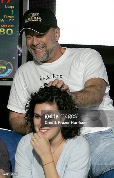 Actor Bruce Willis and daughter Rumer Willis are seen onstage during Playstation BANDtogether, a benefit presented by Sony Computer Enterainment...