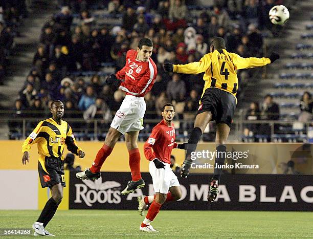 Mohamed Aboutrika of Al Ahly and Redha Tukar of Al Ittihad in action during the FIFA Club World Championship Toyota Cup Japan 2005 the first round...