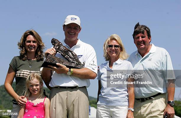 Ernie Els of South Africa with the trophy for winning The Dunhill Championships with his wife Liezl Els, daughter Samantha Els and Gaynor Rupert and...