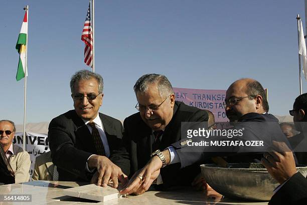 Iraqi President Jalal Talabani , US ambassador to Iraq Zalmay Khalilzad and minister of planning Barham Saleh lay the cornerstone of the American...