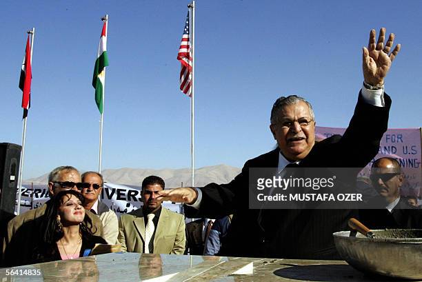 Iraqi President Jalal Talabani salutes the crowds after laying the cornerstone of the American University in Suleimaniya during a ceremony in the...