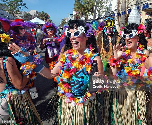 In this handout photo, Carol Abend of Cudjoe Key, Florida and her friends party on Duval Street during the Fantasy Fest Parade December 10, 2005 in...